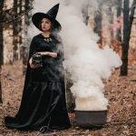 black-witch-holding-skull-in-hands-stroking-it-on-autumn-smoke-forest-background-horror-halloween_t20_gRZnvG