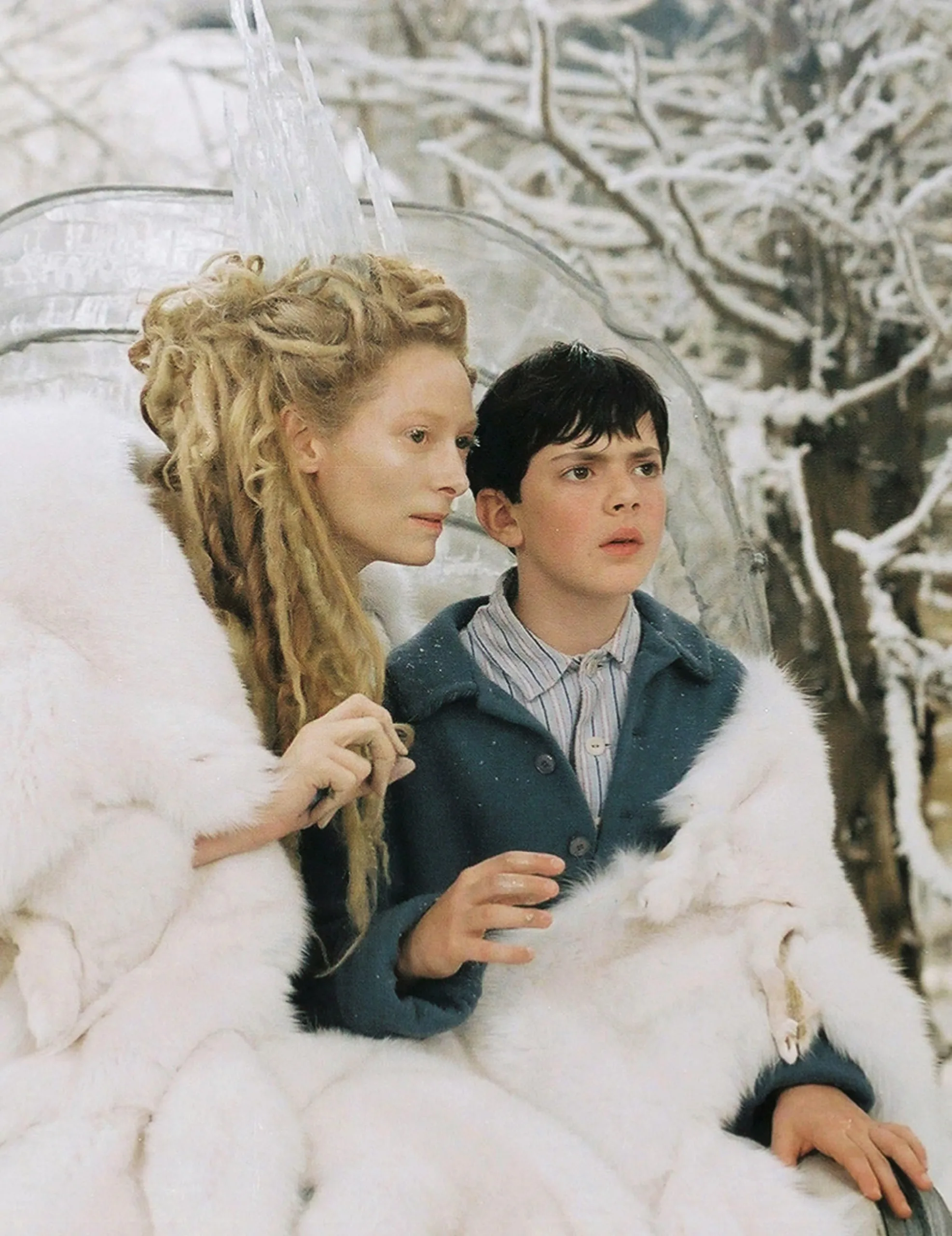 Studio publicity still from The Chronicles of Narnia- The Lion, the Witch and the Wardrobe Tilda Swinton, Skandar Keynes © 2005 Walt Disney Pictures Photo by Phil Bray